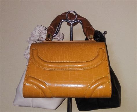 claude leather handbags